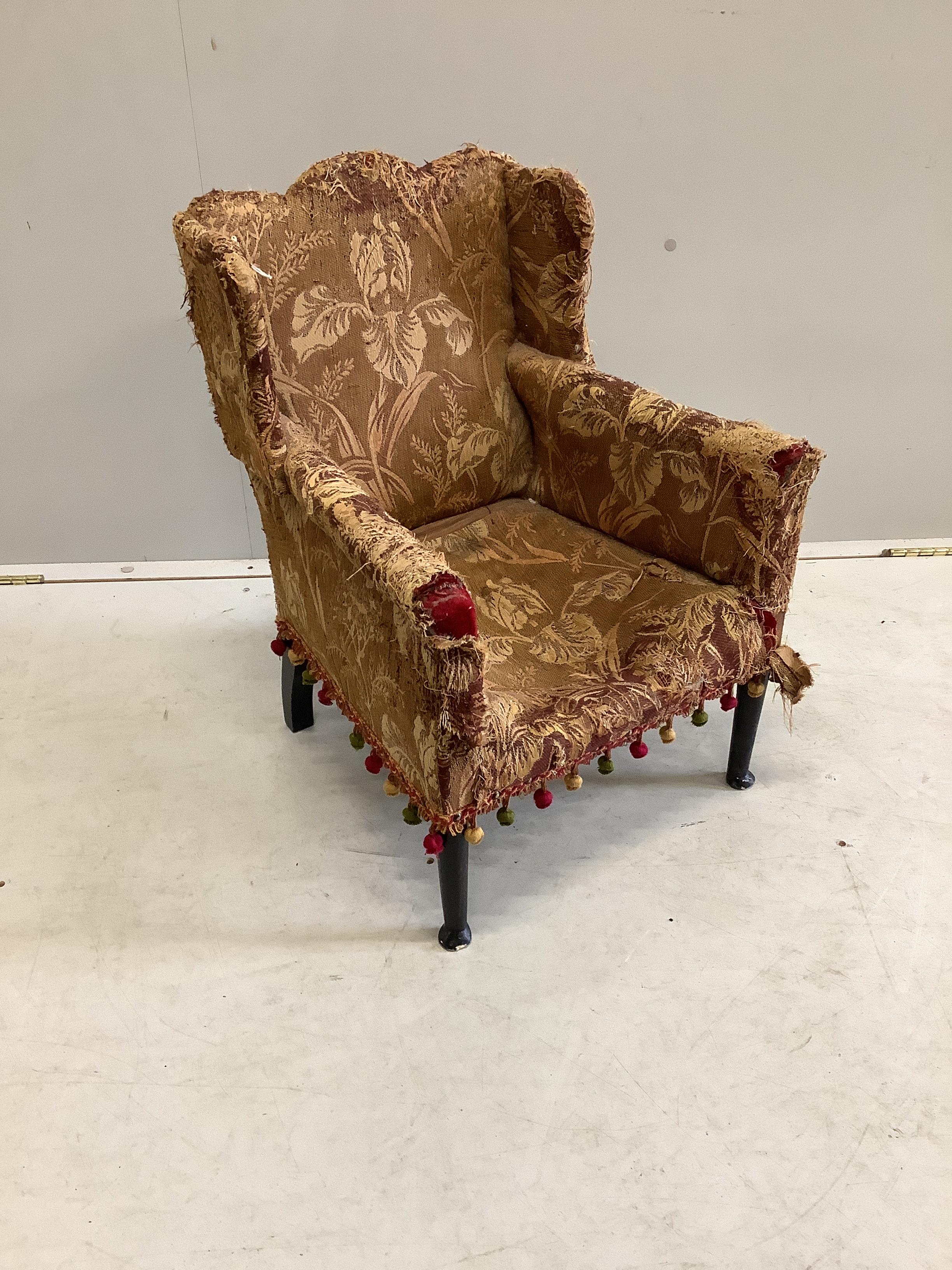 A late 19th century upholstered child's wing armchair, width 46cm, depth 45cm, height 60cm